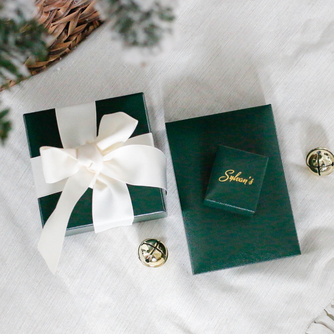 Sylvan's boxes placed under a Christmas tree