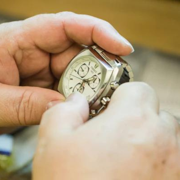 hand holding watch