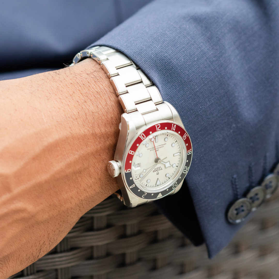 TUDOR Black Bay GMT with a white dial on a man's wrist