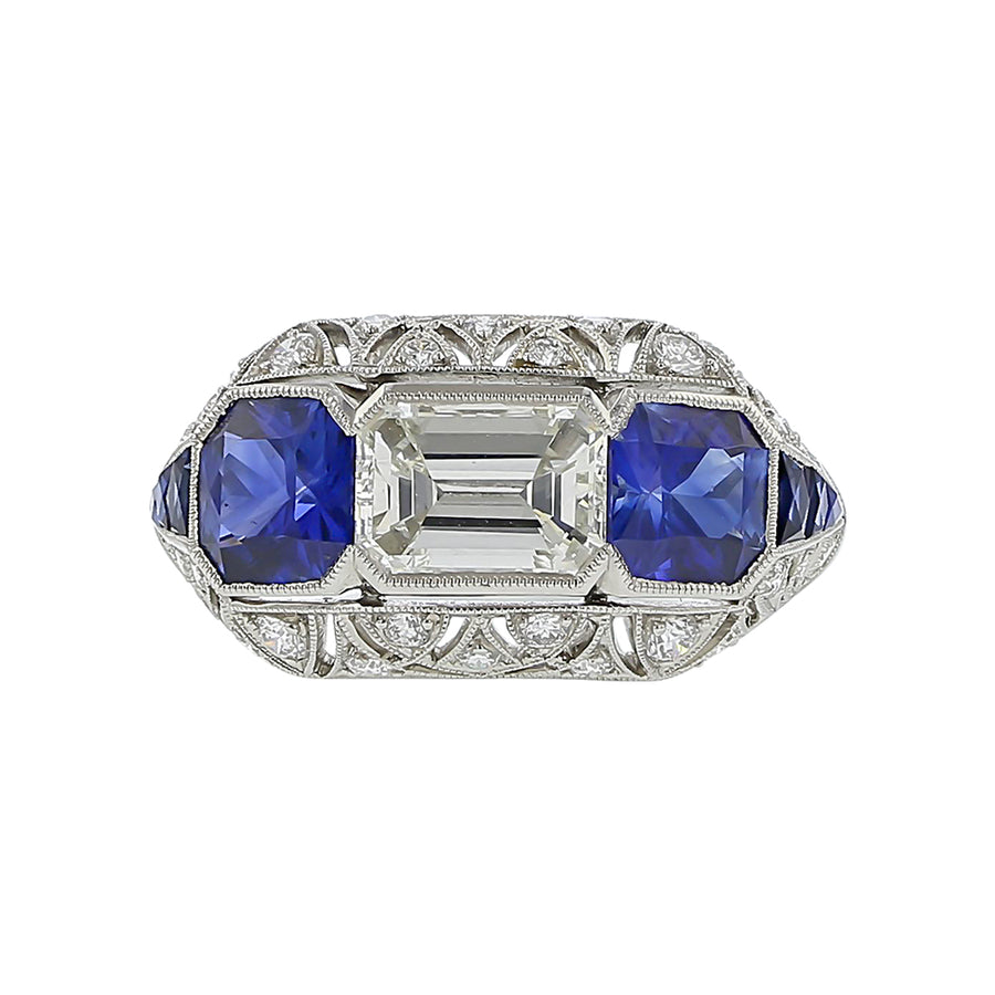 1.00ct Emerald Cut Diamond, 0.34ct Diamond, and 2.00ct Sapphire Ring in Platinum