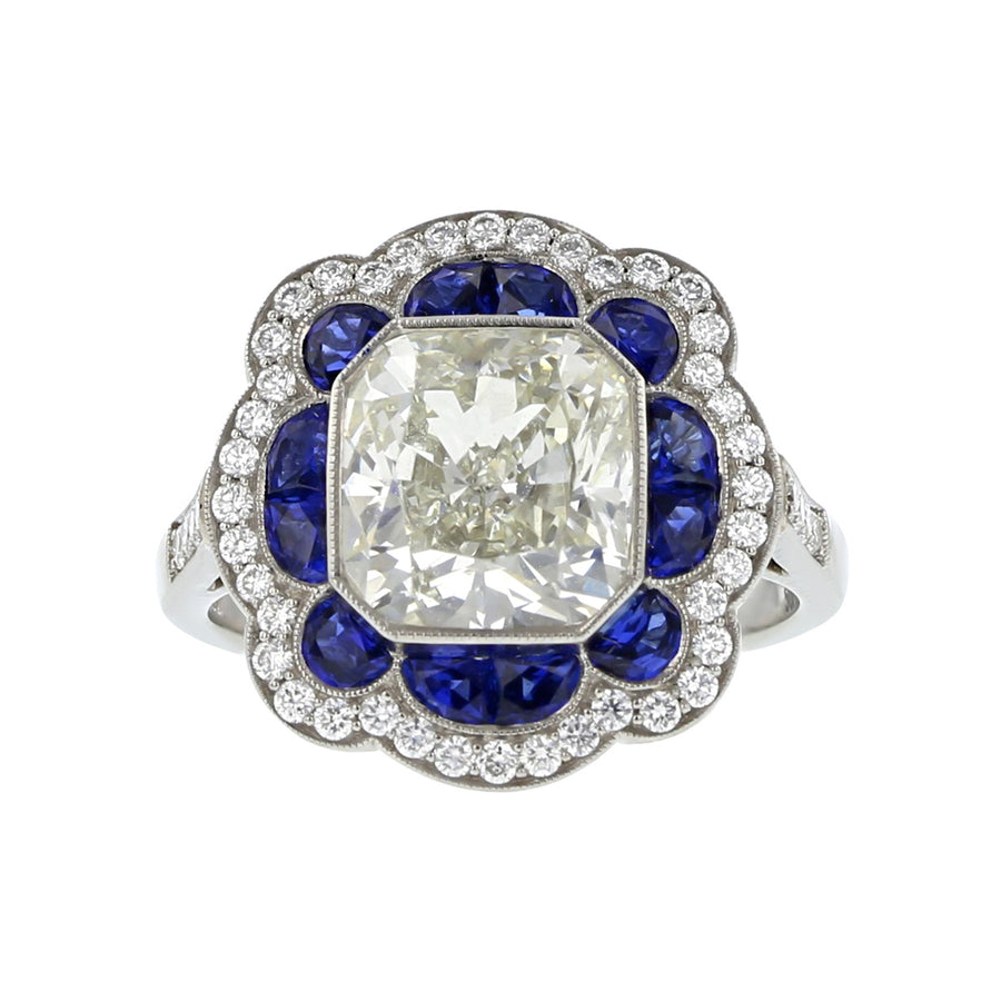 Platinum Brilliant Diamond and Blue Sapphire Halo Ring